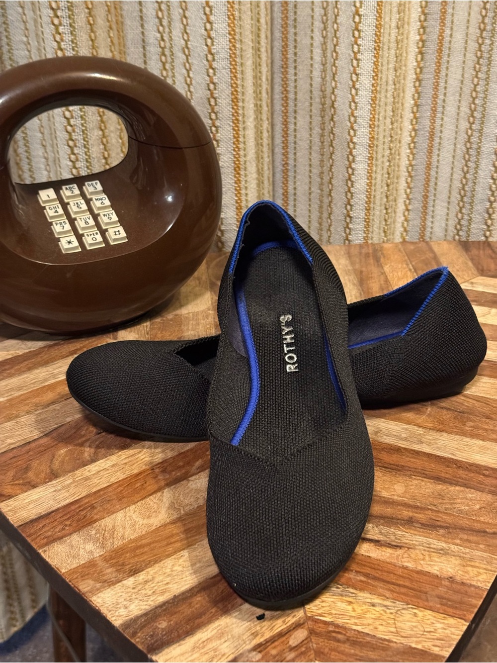 Rothy's The Flat Black Slip-On flats with Blue Trim